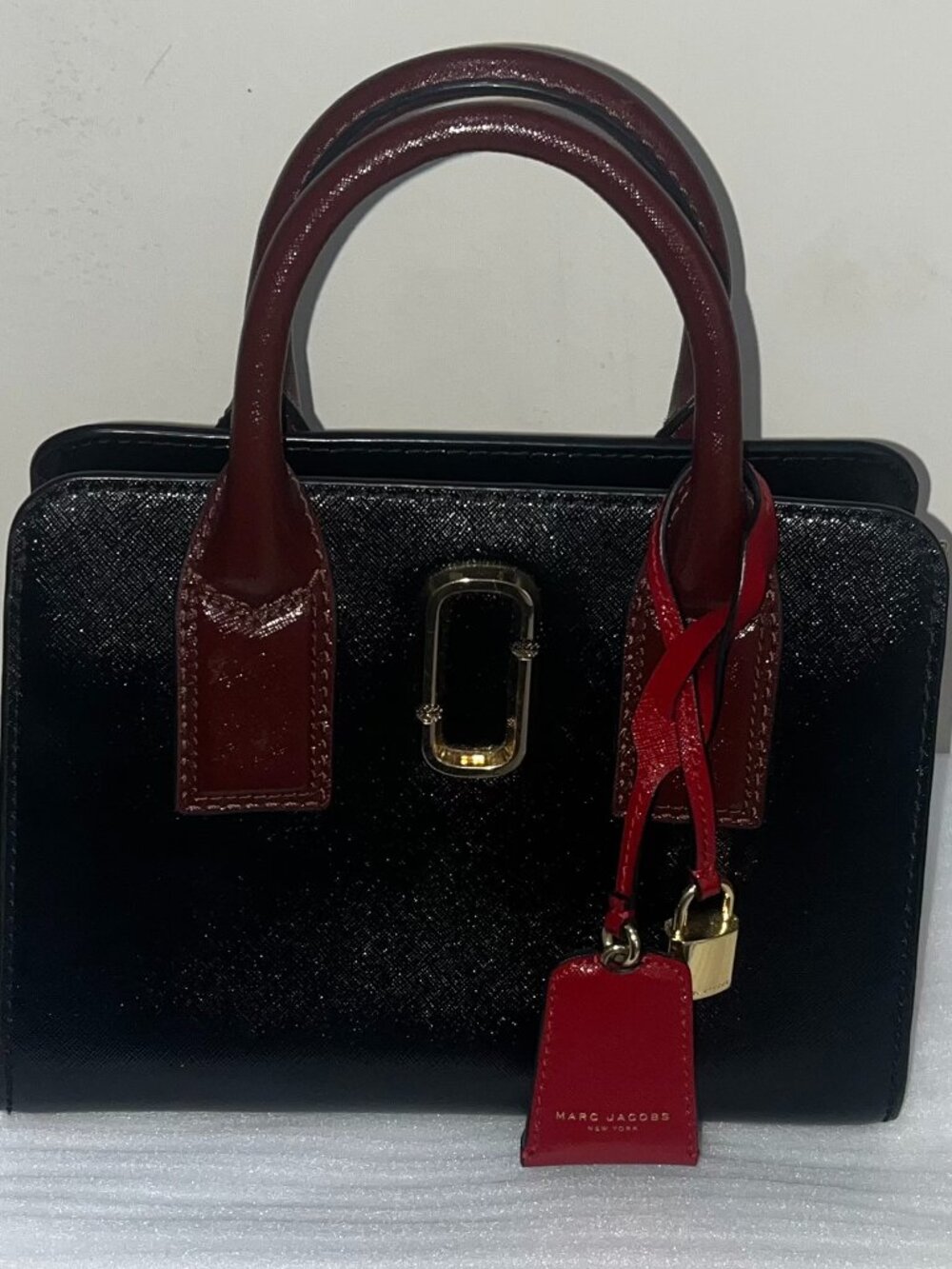 Marc Jacobs Little Big Shot Tote in a black and "Chianti" red colorway.